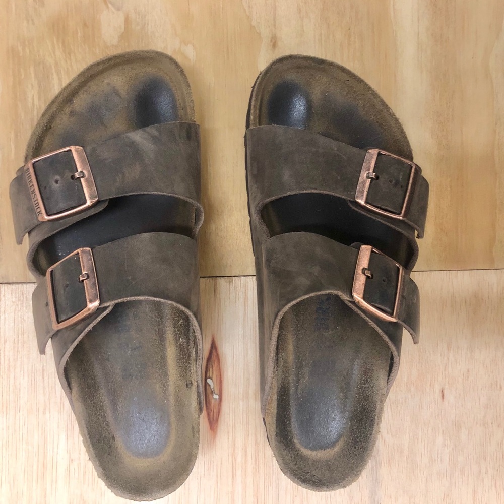 cute pair brown leather birkenstock 2-strap